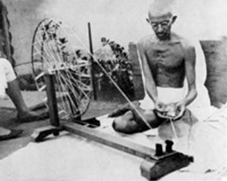Gandhi at the spinning wheel, Sabarmati Ashram, 1925