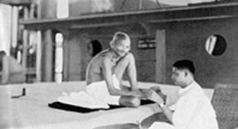 Devdas manicuring his father's nails aboard the ship S.S. Rajputana, September 1931