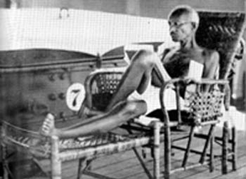 Gandhi at work on the sundeck, aboard S.S. Rajputana. September 1931