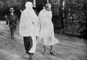 On his early morning walk with Miraben at Villeneuve, Switzerland, December 1931 During his stay here the Milkmen's syndicate wanted to provide food for 'King of India'.)