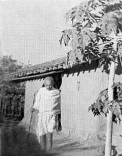 In front of his hut at Segaon, January 1940